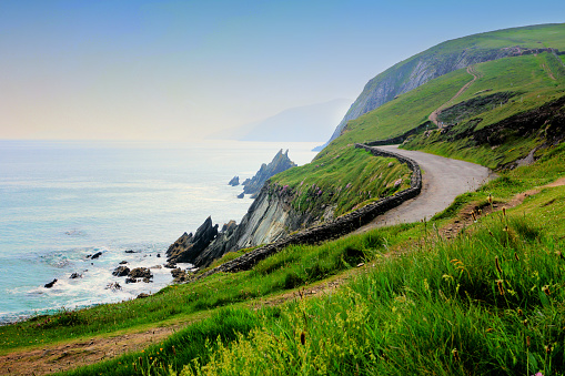 A coastal road winding above Atlantic cliffs on the Wild Atlantic Way